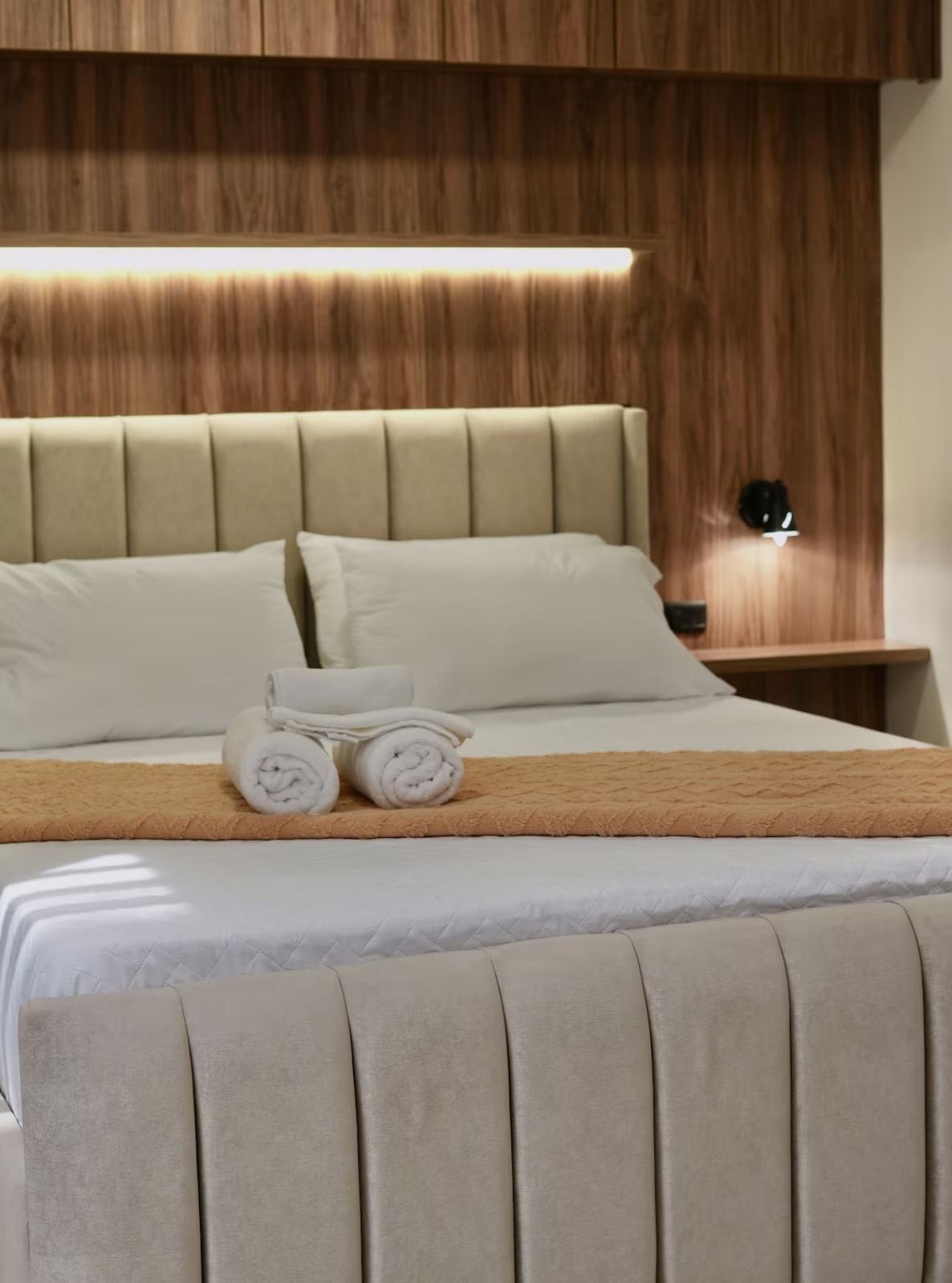 Bedroom detail, teal cushions